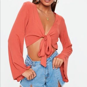 Orange tie up long bell sleeve top